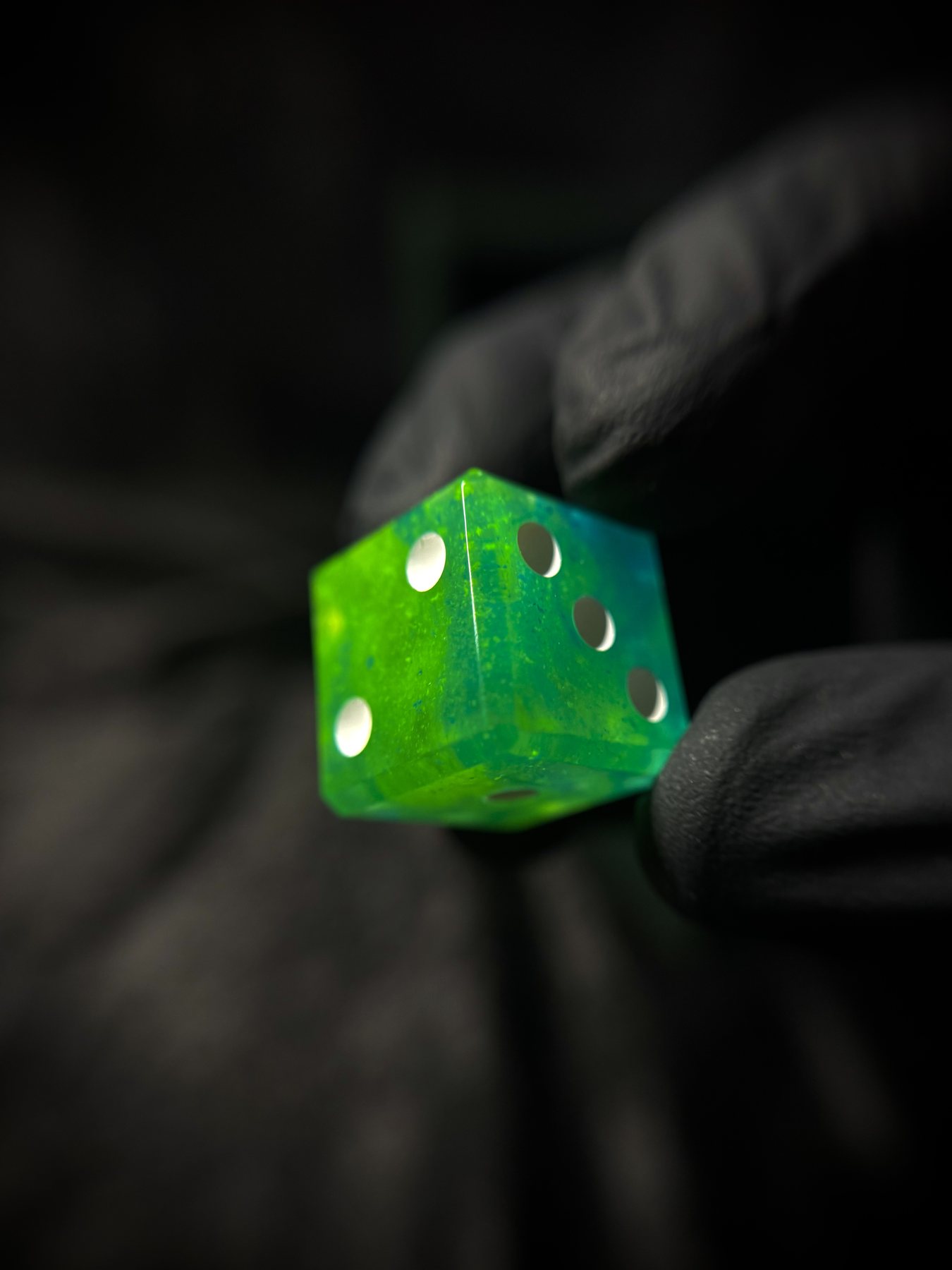 Inspecting a finished handmade die after the workshop